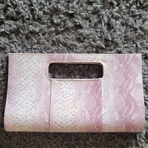 Charming Charlie pink snakeskin clutch